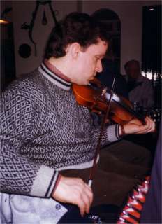 Playing Fiddle in a pub session
