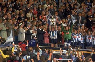 Brian Kilcline is presented with the F.A. Cup